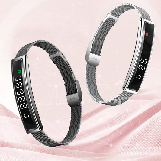 Smart bracelet with digital display on a pink background